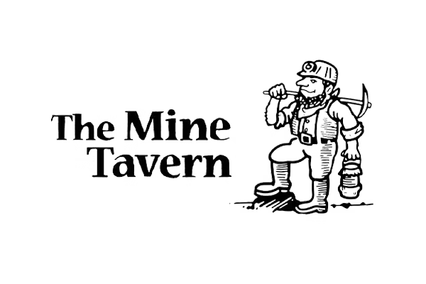 Logo for The Mine Tavern featuring bold text next to a cartoon miner holding a pickaxe over his shoulder and a lantern in his other hand, standing with one foot raised on a rock.