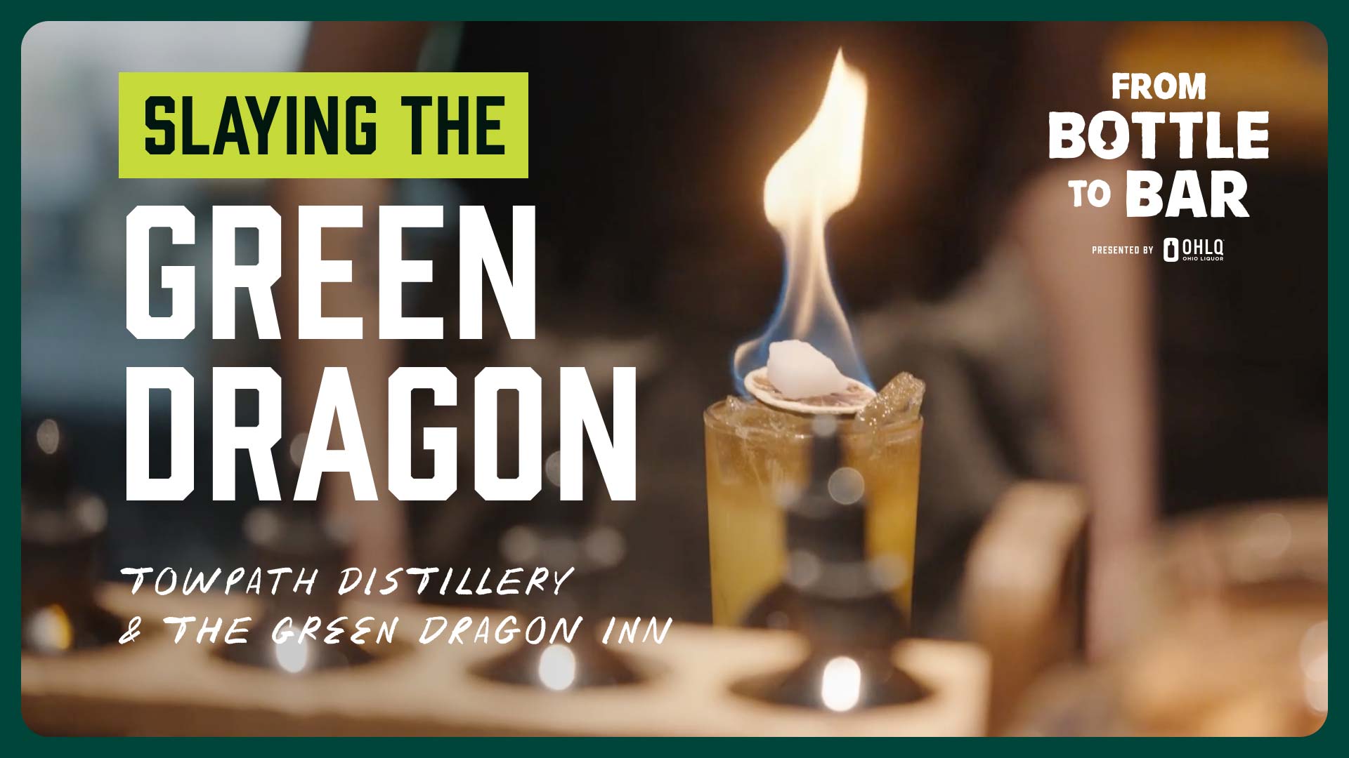 A cocktail with a flaming garnish sits on a bar; bold text reads Slaying the Green Dragon. Smaller text highlights Towpath Distillery + The Green Dragon Inn, with From Bottle to Bar presented by Ohio.